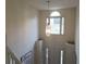 Bright foyer featuring a soaring ceiling and decorative pendant light creating a welcoming entrance at 111 Bexley Ln, Douglasville, GA 30134