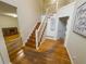 Bright foyer features hardwood floors, staircase, and decor, creating a welcoming entrance to the home at 111 Bexley Ln, Douglasville, GA 30134