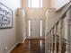 Bright foyer featuring a soaring ceiling, beautiful hardwood floors and white trim at 111 Bexley Ln, Douglasville, GA 30134