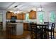 Well-lit kitchen area with an island, modern lighting, and wood flooring at 111 Bexley Ln, Douglasville, GA 30134