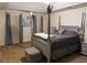 Bedroom showcasing a four poster bed, neutral carpet, and abundant natural light creating a relaxing retreat at 111 Bexley Ln, Douglasville, GA 30134