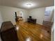 Versatile room features hardwood floors, a desk, and decor, ideal for use as an office or study area at 111 Bexley Ln, Douglasville, GA 30134