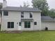 The exterior of the home, displaying the back yard with lush green grass and a patio at 7593 Watson Bay Ct, Stone Mountain, GA 30087