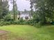 View of backyard with lush greenery at 7593 Watson Bay Ct, Stone Mountain, GA 30087