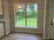 Sunlit breakfast nook with a window offering serene views of the backyard at 7593 Watson Bay Ct, Stone Mountain, GA 30087