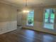 Elegant dining room featuring new flooring and trim at 7593 Watson Bay Ct, Stone Mountain, GA 30087