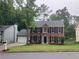 Beautiful two-story brick home with a manicured lawn and a two-car garage at 7593 Watson Bay Ct, Stone Mountain, GA 30087