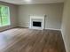 Spacious living room with hardwood floors and a cozy fireplace at 7593 Watson Bay Ct, Stone Mountain, GA 30087