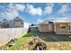Fenced backyard with small lawn area featuring a fire pit and seating at 109 Rockefeller Ln, Dallas, GA 30157