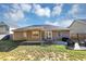 Spacious backyard featuring outdoor seating area and a well-maintained lawn at 109 Rockefeller Ln, Dallas, GA 30157