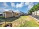 Wide shot of the backyard featuring the patio and lawn area at 109 Rockefeller Ln, Dallas, GA 30157