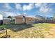 Backyard with grass lawn, fenced perimeter and patio with outdoor seating at 109 Rockefeller Ln, Dallas, GA 30157