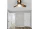 Modern bedroom offers ample space with a ceiling fan and an attached private bathroom at 109 Rockefeller Ln, Dallas, GA 30157