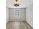 Cozy bedroom features natural light from one window and neutral paint at 109 Rockefeller Ln, Dallas, GA 30157