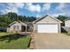 Charming one-story home featuring stone accents, neutral siding, and a well-manicured lawn with an attached two-car garage at 109 Rockefeller Ln, Dallas, GA 30157