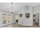 Spacious living room features wood floors and large windows with natural light at 109 Rockefeller Ln, Dallas, GA 30157