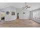 Spacious living room boasts vaulted ceilings, natural light, and modern laminate flooring at 109 Rockefeller Ln, Dallas, GA 30157