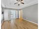 Bright bedroom showing hardwood floors and ensuite bathroom access at 109 Rockefeller Ln, Dallas, GA 30157
