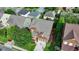 Aerial view of a well-maintained property with a landscaped yard and mature trees in a residential neighborhood at 4495 Hedgewood Dr, Cumming, GA 30041