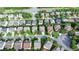 An aerial view of a suburban neighborhood, showcasing neatly arranged homes and well-maintained streets lined with mature trees at 4495 Hedgewood Dr, Cumming, GA 30041