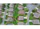 Aerial view of a home with a deck and well-manicured lawn, surrounded by lush trees in a neighborhood at 4495 Hedgewood Dr, Cumming, GA 30041