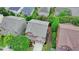 Aerial view of the home featuring a well-maintained roof, landscaping, and a paved driveway at 4495 Hedgewood Dr, Cumming, GA 30041