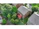 Aerial shot showcases the home's backyard deck and lawn area, enclosed by mature trees for privacy at 4495 Hedgewood Dr, Cumming, GA 30041