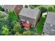 Aerial shot showcases the home's backyard deck and lawn area, enclosed by mature trees for privacy at 4495 Hedgewood Dr, Cumming, GA 30041