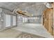 Unfinished basement with vapor barrier, drop ceiling, and exterior door at 4495 Hedgewood Dr, Cumming, GA 30041