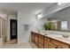 Bathroom boasting double sinks, a large mirror, and a stand-up shower at 4495 Hedgewood Dr, Cumming, GA 30041