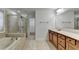 Bathroom showcasing tub, walk-in shower, and double vanity at 4495 Hedgewood Dr, Cumming, GA 30041