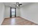 Bedroom with hardwood floors, a ceiling fan, recessed lighting, and a window with gray curtains at 4495 Hedgewood Dr, Cumming, GA 30041