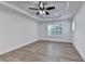 An empty bedroom with light-colored walls and flooring, a ceiling fan, and a window at 4495 Hedgewood Dr, Cumming, GA 30041
