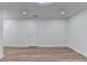 Bedroom with gray wood-look flooring, white walls, and recessed lighting at 4495 Hedgewood Dr, Cumming, GA 30041