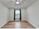 Bedroom with hardwood floors, a ceiling fan, recessed lighting, and a window with an outside view at 4495 Hedgewood Dr, Cumming, GA 30041