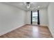 Bedroom with hardwood floors, a ceiling fan, recessed lighting, and a window with decorative curtains at 4495 Hedgewood Dr, Cumming, GA 30041