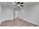 This bedroom has hardwood floors, white trim, and a ceiling fan with lights at 4495 Hedgewood Dr, Cumming, GA 30041