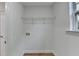 A small closet with a wire rack and wood-look floors at 4495 Hedgewood Dr, Cumming, GA 30041