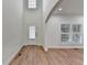 Bright foyer with hardwood floors, white walls, and ample natural light at 4495 Hedgewood Dr, Cumming, GA 30041