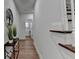 Bright hallway featuring hardwood floors and decorative plants at 4495 Hedgewood Dr, Cumming, GA 30041