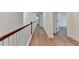Hallway featuring beautiful wood floors and white trim throughout at 4495 Hedgewood Dr, Cumming, GA 30041