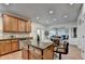 Open kitchen with island and breakfast bar, showcasing granite counters, stainless appliances and seamless flow to living areas at 4495 Hedgewood Dr, Cumming, GA 30041