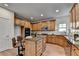 Modern kitchen with granite countertops, stainless steel appliances, and a central island with bar seating at 4495 Hedgewood Dr, Cumming, GA 30041
