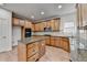 Beautiful kitchen featuring wood cabinets, granite counters, stainless steel appliances, and a center island at 4495 Hedgewood Dr, Cumming, GA 30041