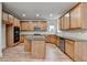 Spacious kitchen featuring wood cabinets, granite counters, stainless steel appliances and a center island at 4495 Hedgewood Dr, Cumming, GA 30041