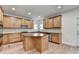 Modern kitchen featuring a central island, stainless appliances, and ample cabinetry at 4495 Hedgewood Dr, Cumming, GA 30041