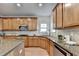 Modern kitchen with granite countertops, stainless steel appliances, and a central island with bar seating at 4495 Hedgewood Dr, Cumming, GA 30041