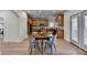 Open kitchen with an island and stainless steel appliances is situated adjacent to a breakfast area at 4495 Hedgewood Dr, Cumming, GA 30041