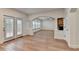 Bright living space with hardwood floors, a charming brick fireplace, and multiple windows at 4495 Hedgewood Dr, Cumming, GA 30041