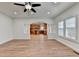 Open-concept living space with wood floors and view of kitchen at 4495 Hedgewood Dr, Cumming, GA 30041